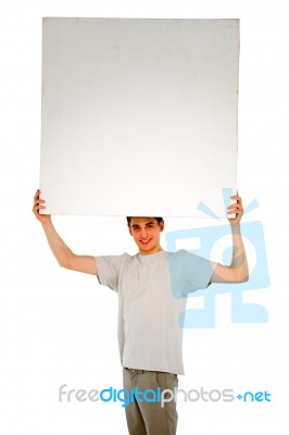 Teenage Boy Holding Blank Board Stock Photo