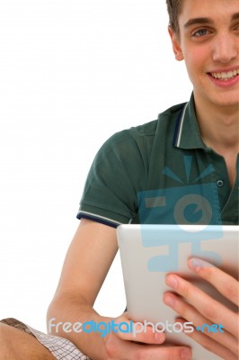 Teenage Boy holding Ipad Stock Photo