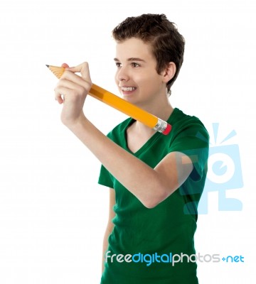 Teenage Boy Holding Pencil Stock Photo