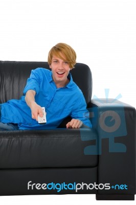 Teenage Boy Holding Tv Remote Stock Photo