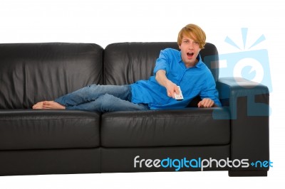 Teenage Boy Holding Tv Remote Stock Photo