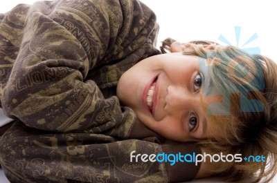 Teenage Boy Lying Stock Photo