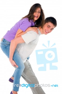 Teenage Boy Piggybacking Girl Stock Photo