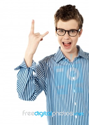 teenage Boy showing rock sign Stock Photo