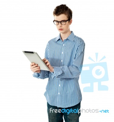 teenage Boy Using Touchpad Device Stock Photo