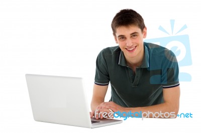 Teenage Boy Working With Laptop Stock Photo