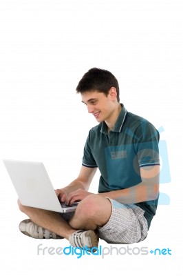 Teenage Boy working With Laptop Stock Photo