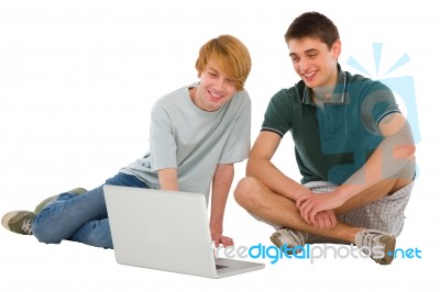 Teenage Boys Using Laptop Stock Photo