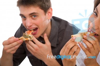 Teenage Couple Eating Pizza Stock Photo