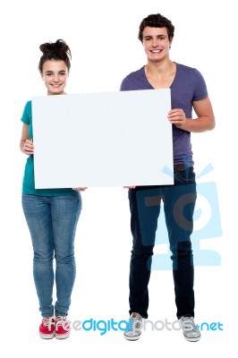 Teenage Couples Holding Blank Board Stock Photo