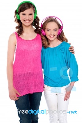 Teenage Friends Listening Music Stock Photo