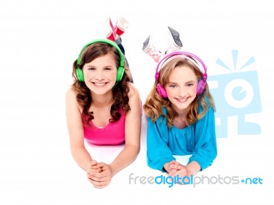 Teenage Friends Listening Music Stock Photo