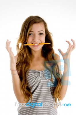 Teenage Girl Biting And Gesturing Stock Photo