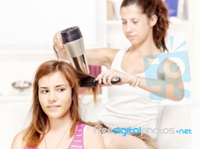 Teenage Girl Dries Hair To Her Friends Stock Photo