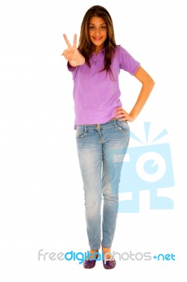 Teenage Girl Giving Peace Sign Stock Photo