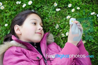 Teenage Girl Looking Daisies Stock Photo