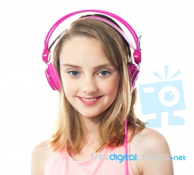 teenage Girl Wearing Pink Headphone Stock Photo