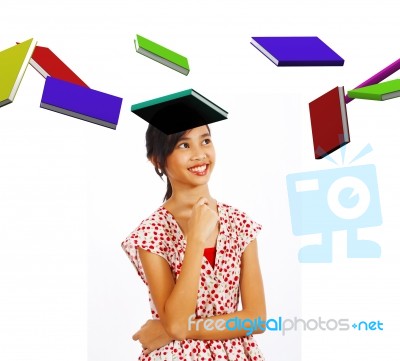 Teenage Student With Flying Books Stock Photo