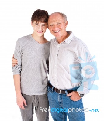 Teenager And Grandfather, In Studio Stock Photo