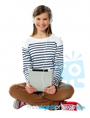 Teenager Enjoying Music Through Headphones Stock Photo