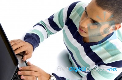 Teenager Guy Working On Laptop Stock Photo