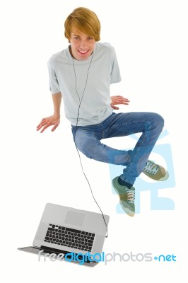 teenager listening music With PC Stock Photo