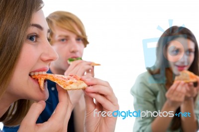 Teenagers Eating Pizza Stock Photo