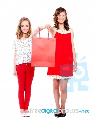 Teenagers Giving Shopping Bag Stock Photo