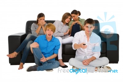 Teenagers holding TV remote Stock Photo