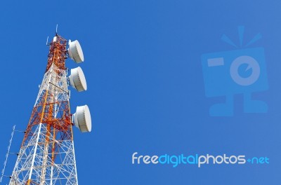 Telecommunication Tower On Blue Sky Background Stock Photo