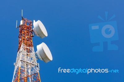 Telecommunication Tower On Blue Sky Background Stock Photo