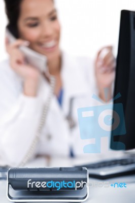 Telephone Of Focus, Doctor Talking With It Stock Photo