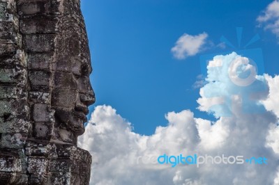 Temple Face Staring Into The Clouds Stock Photo