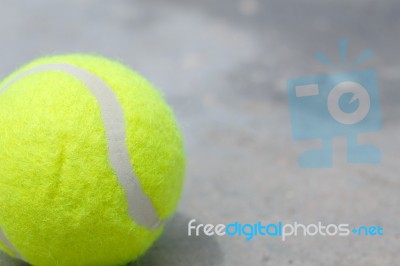 Tennis Ball On The Ground Stock Photo