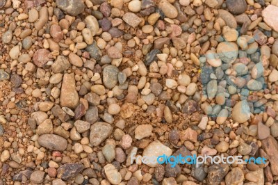 Textured Background Of Stones And River Sand Stock Photo