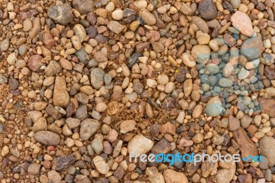 Textured Background Of Stones And River Sand Stock Photo