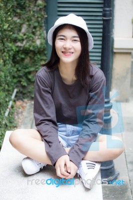 Thai Adult Girl White Cap Gray T-shirt Beautiful Girl Relax And Smile Stock Photo