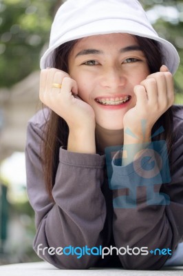 Thai Adult Girl White Cap Gray T-shirt Beautiful Girl Relax And Smile Stock Photo