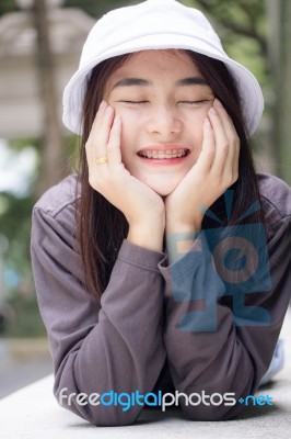 Thai Adult Girl White Cap Gray T-shirt Beautiful Girl Relax And Smile Stock Photo