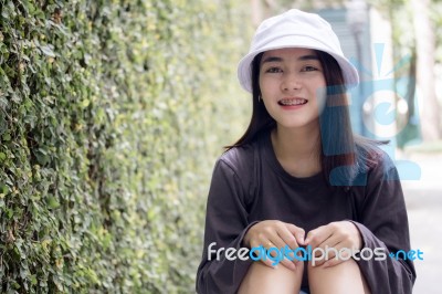 Thai Adult Girl White Cap Gray T-shirt Beautiful Girl Relax And Smile Stock Photo