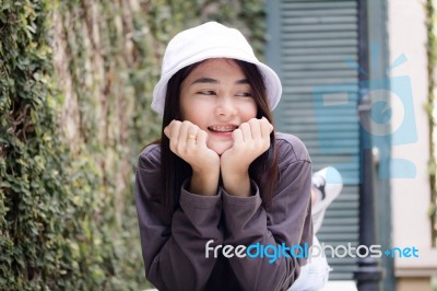 Thai Adult Girl White Cap Gray T-shirt Beautiful Girl Relax And Smile Stock Photo