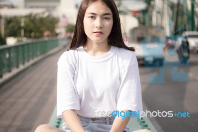 Thai Adult Girl White T-shirt Beautiful Girl Relax And Smile Stock Photo