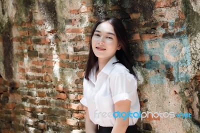 Thai Adult Student University Uniform Beautiful Girl Relax And Smile Stock Photo