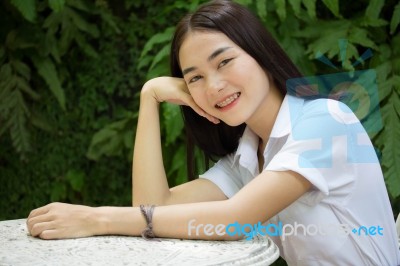 Thai Adult Student University Uniform Beautiful Girl Relax And Smile Stock Photo