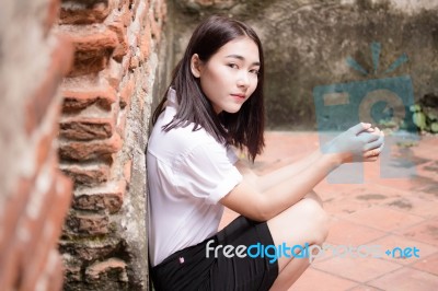 Thai Adult Student University Uniform Beautiful Girl Relax And Smile Stock Photo