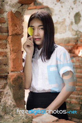 Thai Adult Student University Uniform Beautiful Girl Relax And Smile Stock Photo