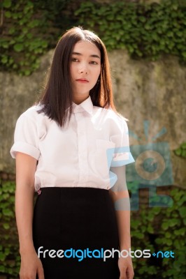 Thai Adult Student University Uniform Beautiful Girl Relax And Smile Stock Photo