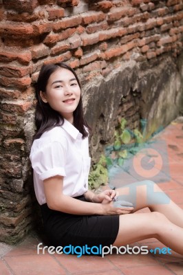 Thai Adult Student University Uniform Beautiful Girl Relax And Smile Stock Photo