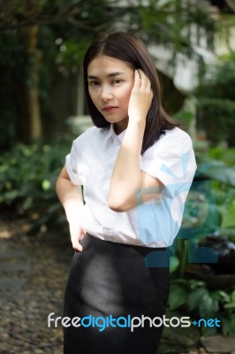 Thai Adult Student University Uniform Beautiful Girl Relax And Smile Stock Photo