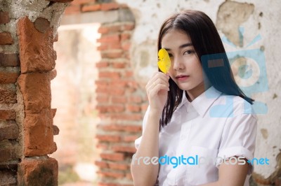 Thai Adult Student University Uniform Beautiful Girl Relax And Smile Stock Photo